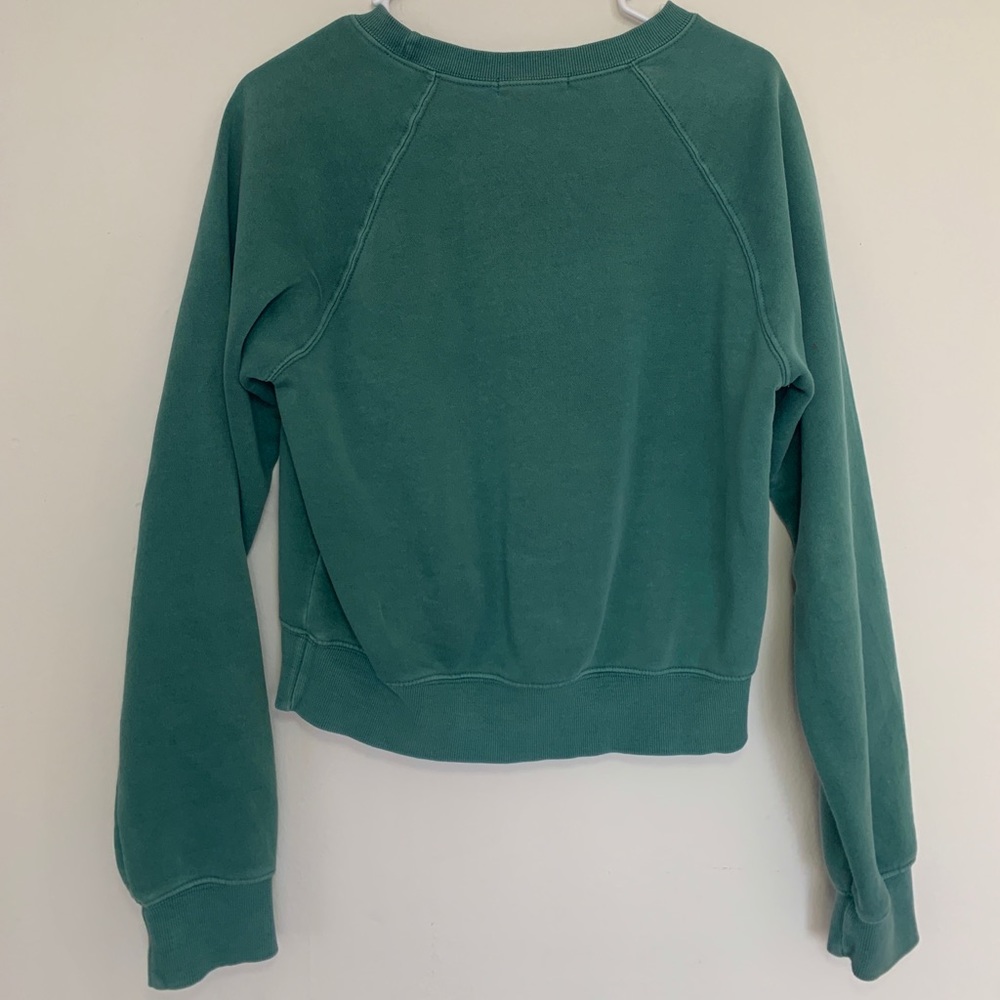 small green sweater